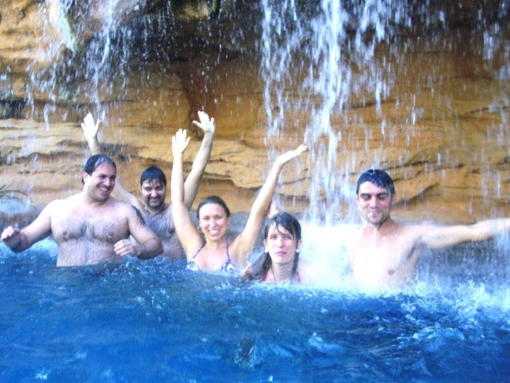 Xua-ing under a waterfall: Helder, Alessander, Viviane, Cris and Fernando.