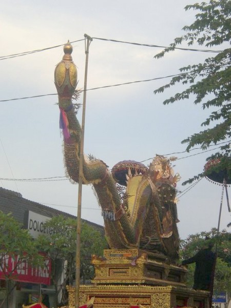 The procession's dragon was so tall, that the power lines had to be moved so it could pass by.