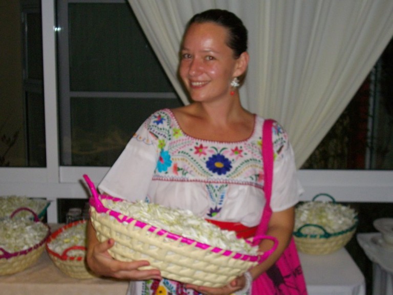 Petra holds one of our flower baskets.