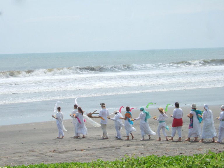 Our procession arrives at the ocean.