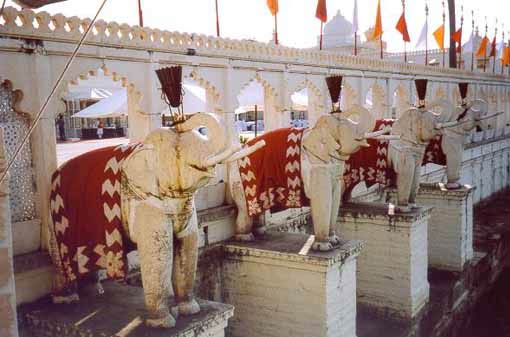 Eight stone elephants are Guardians of the palace walls.