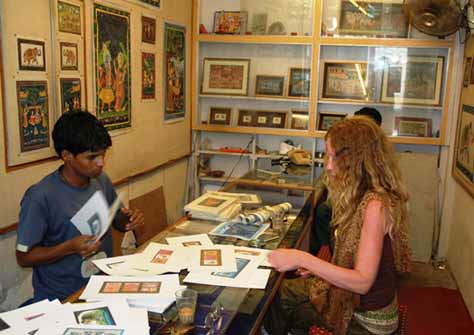 Alix peruses an amazing selection of Rajasthani miniature paintings.
