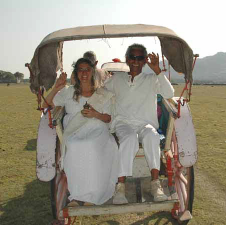 Z*ra Hoku and Iree enjoy a peaceful ride in their horse wagon.  She carries the puja pot full of lake water for our Activation Ceremony.