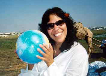Ti-Mon-Ra holds the world in her hands.
