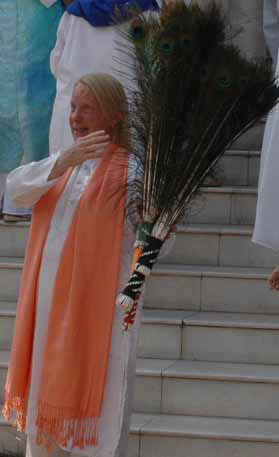 Kimberly with two bundles of peacock feathers  from the 7th Gate Activation:  one for His Holiness and one to take to Tibet.
