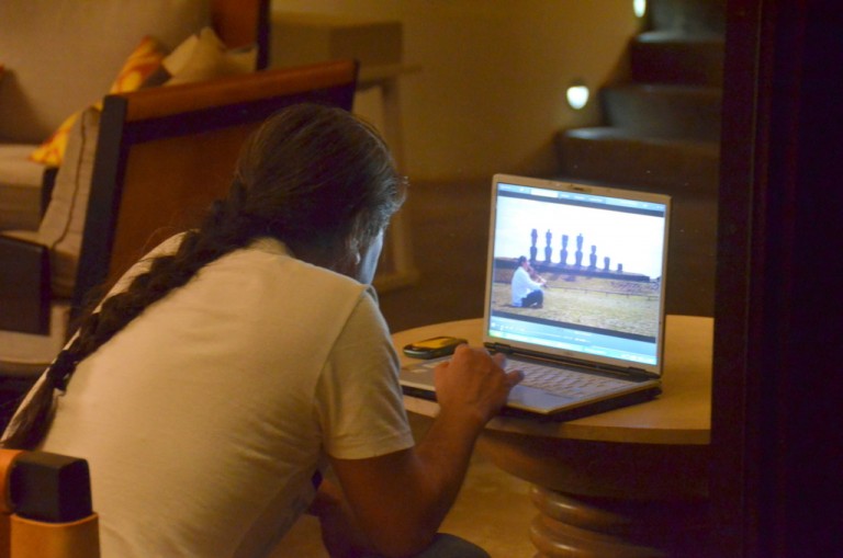 Jorge watches the video of him playing the flute while asking Anakena for permission to hold our ceremony there.